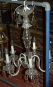 A 20th Century glass five light chandelier, 69cm long.