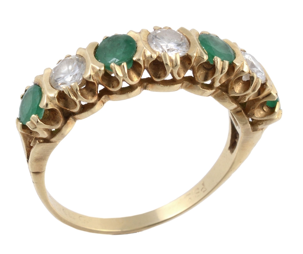A seven stone emerald and diamond ring, the round cut emeralds interspaced...  A seven stone emerald