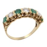 A seven stone emerald and diamond ring, the round cut emeralds interspaced...  A seven stone emerald