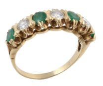 A seven stone emerald and diamond ring, the round cut emeralds interspaced...  A seven stone emerald