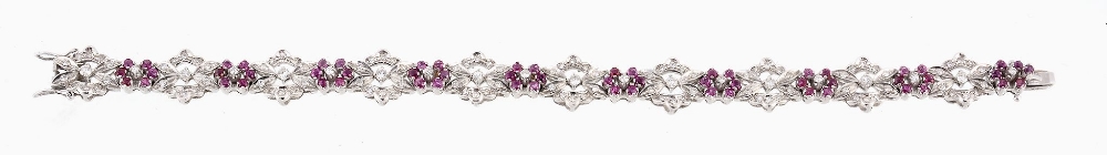 A ruby and diamond bracelet, the articulated bracelet composed of foliate...  A ruby and diamond