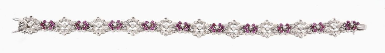 A ruby and diamond bracelet, the articulated bracelet composed of foliate...  A ruby and diamond