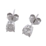 A pair of diamond ear studs, the brilliant cut diamond, in a four claw setting  A pair of diamond