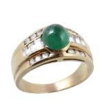 An emerald and diamond dress ring , the cabochon emerald above baguette and...  An emerald and
