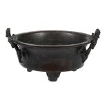 A bronze censer, Ming Dynasty or later  , supported on four feet, with applied long-tailed mythical