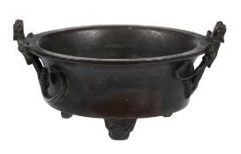 A bronze censer, Ming Dynasty or later  , supported on four feet, with applied long-tailed mythical