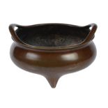 A bronze tripod censer  , of compressed form with outswept pierced handles, Xuande six-character