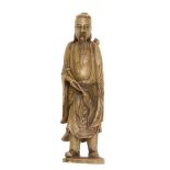 A soaptone figure of a Immortal, 19th century  , standing holding a fly-wisk, with carved details,