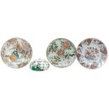 A Chinese Famille Verte circular dish,   Kangxi,    painted with four panels of flowers surrounding