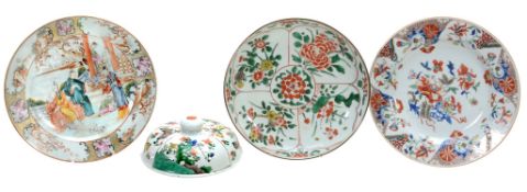 A Chinese Famille Verte circular dish,   Kangxi,    painted with four panels of flowers surrounding