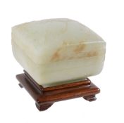 A celadon jade square box and cover, probably Qianlong  , the cover carved with a figure within