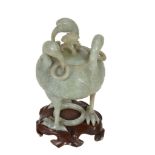 A celadon jade covered censer and cover  , the ovoid body carved with three birds each with rings