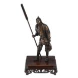 Miyao Eisuke: A parcel gilt bronze figure of a Boatman  , he stands dressed in a short coat