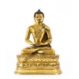 A Mongolian gilded bronze figure of Buddha  , seated in dhyanasana on a double-lotus base, his