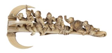 A Japanese Ivory Okimono   carved as a giant anchor upon which a group of fishermen and boys are