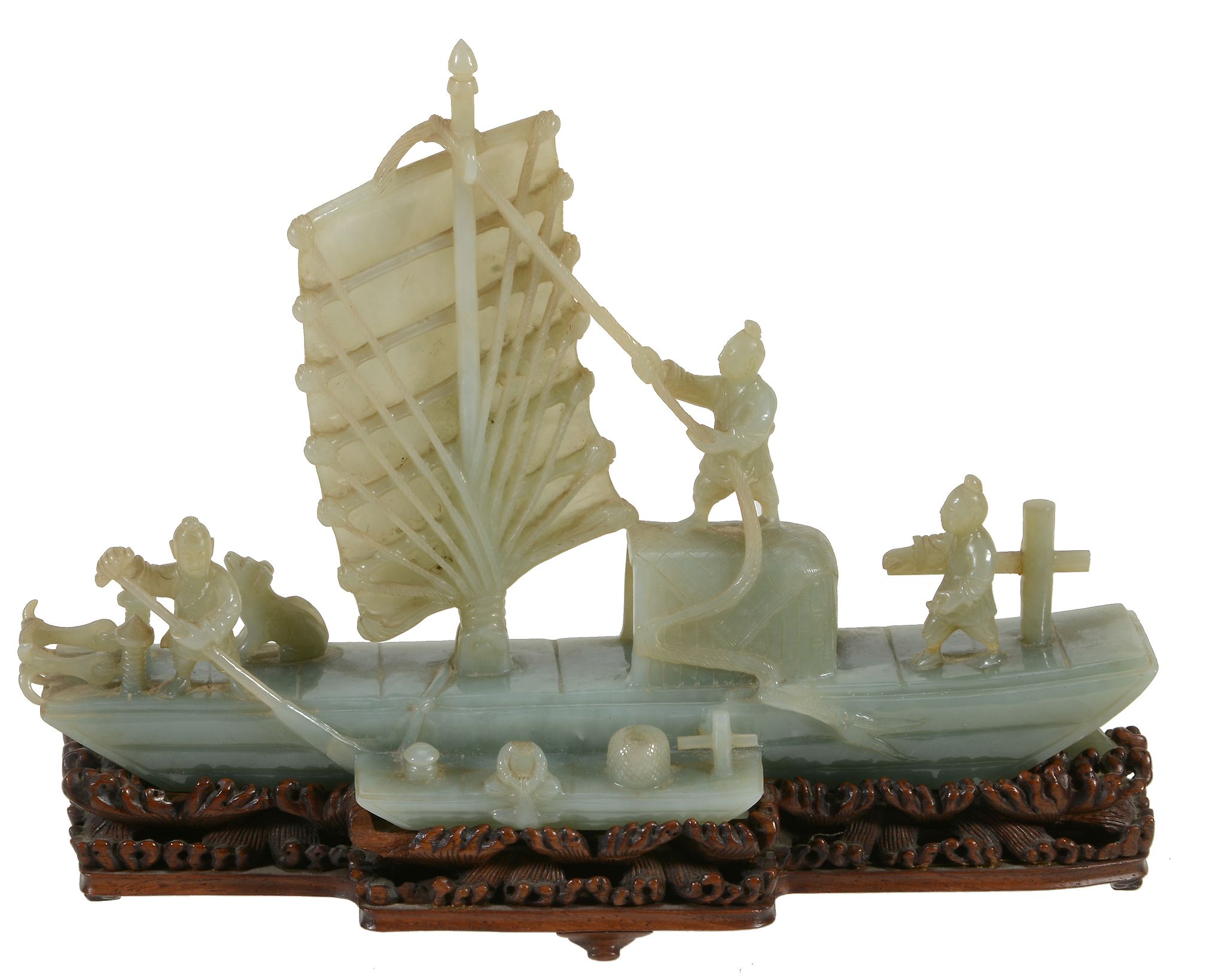 A jadeite model of a junk, 20th century, carved with three sailors on deck and a dog, the vessel