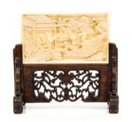 A miniature ivory screen for the scholar s table, 19th century  , finely carved with figures amid