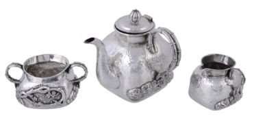 An Export silver rounded square three piece tea service by Tu Mao Xing,   Jiujiang, Jiangxi