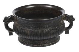 A Chinese bronze gui vessel  , with ribbed body enclosed within geometric bands, 19cm diam