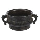 A Chinese bronze gui vessel  , with ribbed body enclosed within geometric bands, 19cm diam