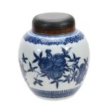 A Chinese blue and white ginger jar  , painted with fruiting pomegranates, 21cm high, wood cover