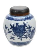 A Chinese blue and white ginger jar  , painted with fruiting pomegranates, 21cm high, wood cover