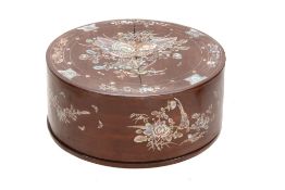 A wood box, 19th century  , of circular shape, delicately inlaid, on the lid and sides, with mother