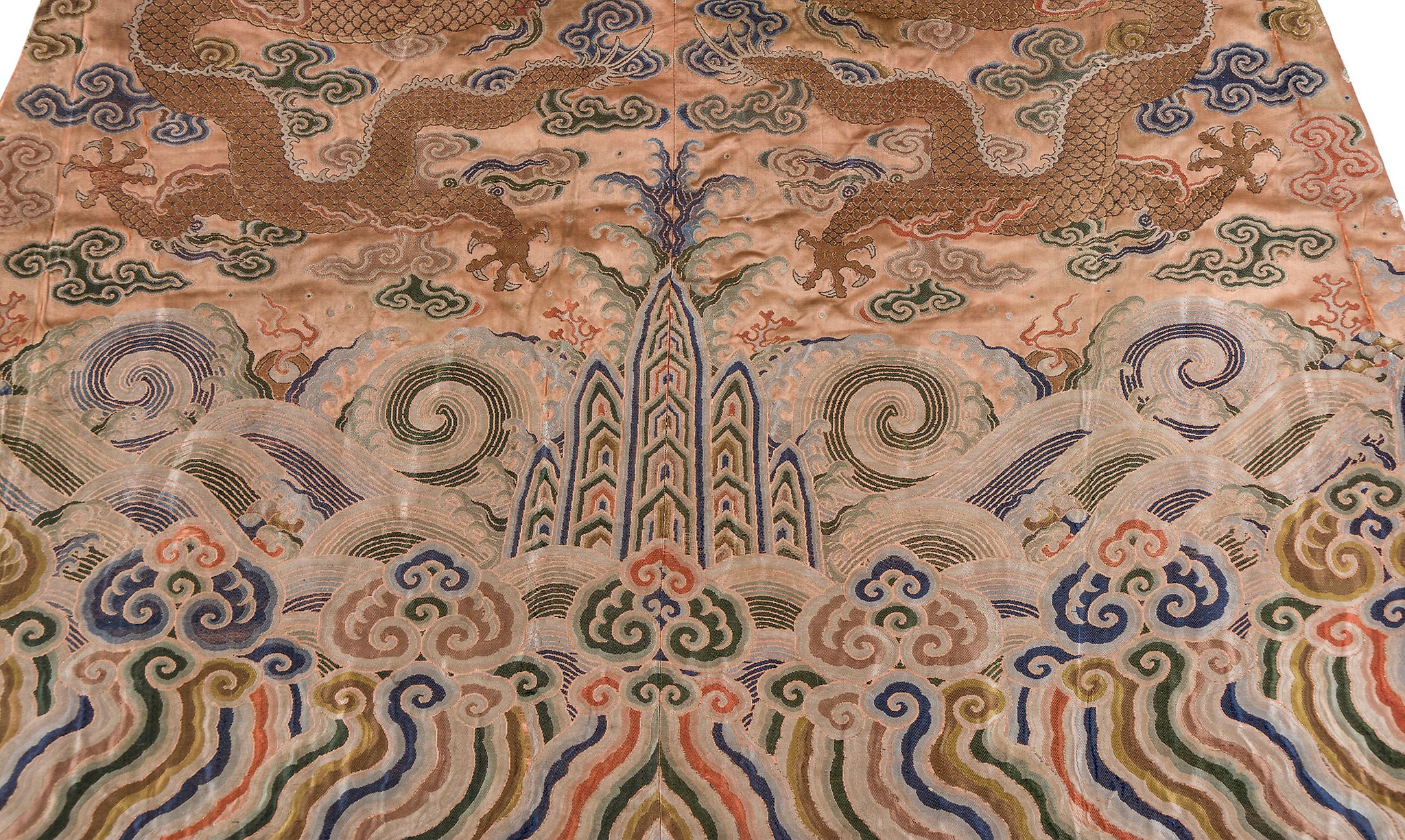 A coral ground silk Tibetan chuba, tailored from 18th century Chinese  kesi  , featuring eight - Image 4 of 8