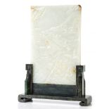 A white jade table screen, 19th century  , the upright rectangular panel finely carved in relief on