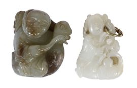 Two jade carvings of a boy and duck group  , the birds holding, respectively, a leafy stem and a