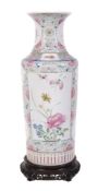 A Chinese  famille rose   vase,   the cylindrical body with flared neck, painted with panels of