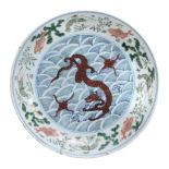 A Chinese  famille verte   saucer dish,   the centre painted with a red dragon , the border with