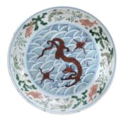 A Chinese  famille verte   saucer dish,   the centre painted with a red dragon , the border with