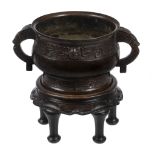 A bronze archaic style two- handled censer, Gui  , the upper band with long-tailed birds reserved