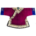 A Han Chinese woman informal coat,  ao  , late Qing  , the cerise coloured damask finely woven with