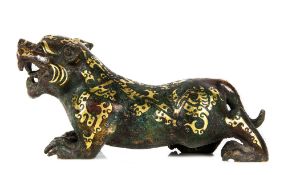 A bronze model of a tiger, Warring States-Western Han style, powerfully cast, prowling forward