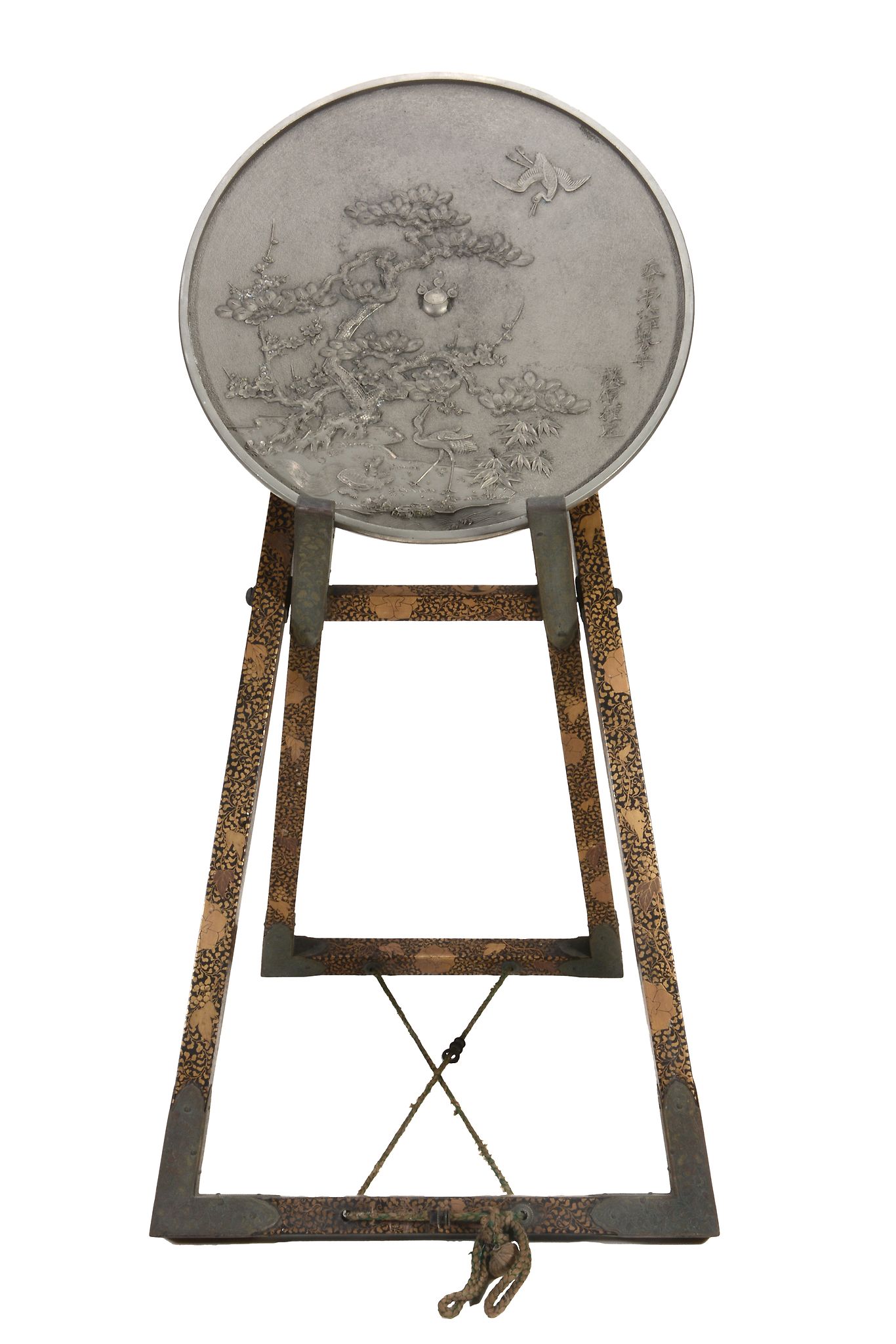 A Large Japanese Bronze Mirror, Case and Stand,   the circular mirror cast to one side with cranes,