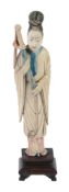 An ivory figure of a standing female figure, 19th century  , dressed in simple robes and holding a