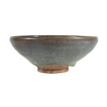 A copper red-splashed Jun bowl, Jin-Yuan dynasty  , well potted, with gently rounded sides rising