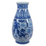 A large blue and white vase,   the tapering ovoid body with flared neck painted with a complex