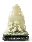 A carved white jade vase, Qing dynasty  , of flattened baluster form with well hollowed interior,