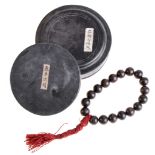 A Buddhist set of prayer beads,  shouchuan  , Qing,   formed with eighteen aloeswood beads,