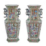 An attractive pair of Cantonese hexagonal famille rose vases, 19th century,   painted with panels