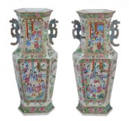 An attractive pair of Cantonese hexagonal famille rose vases, 19th century,   painted with panels