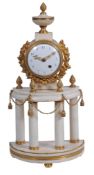 A Louis XVI style gilt brass and white marble mantel timepiece, unsigned, early 19th century,   the