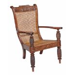A Colonial hardwood planter's armchair, possibly West Indies  A Colonial hardwood planter's