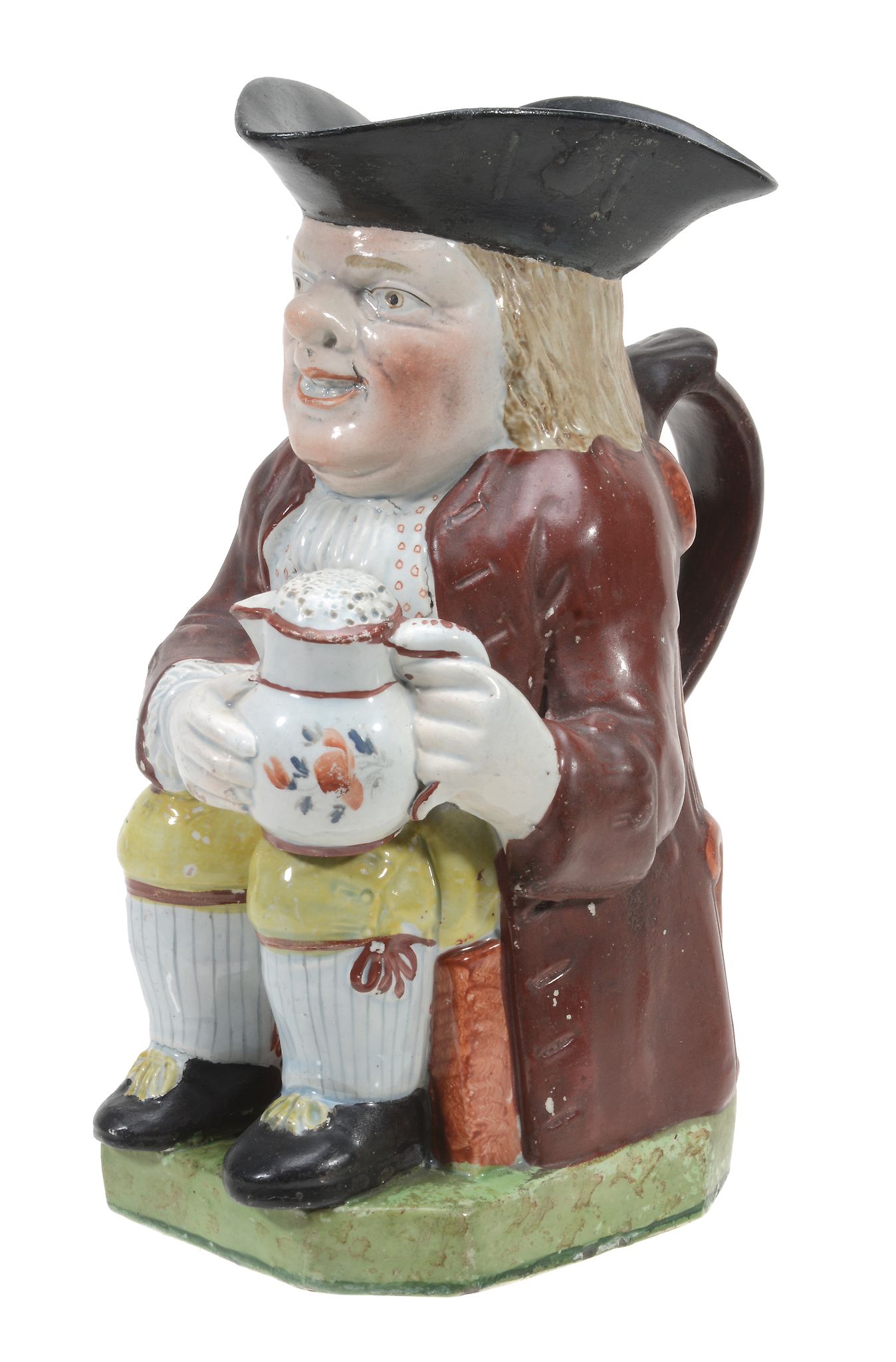 A Staffordshire pearlware Toby jug and a cover , circa 1810  A Staffordshire pearlware Toby jug