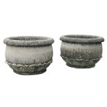 A pair of Continental, probably French carved limestone planters, 20th century  A pair of