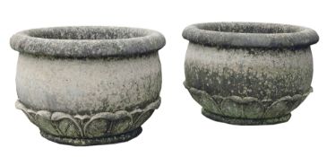 A pair of Continental, probably French carved limestone planters, 20th century  A pair of