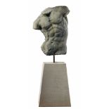 A massive sculpted limestone model of a male torso, after the Gaddi Torso  A massive sculpted